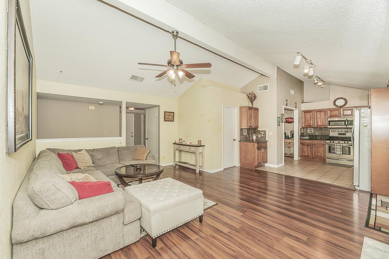 1908 East Niles Avenue Fresno, CA 93720 - Photo 11 of 30 a living room with furniture and wooden floor