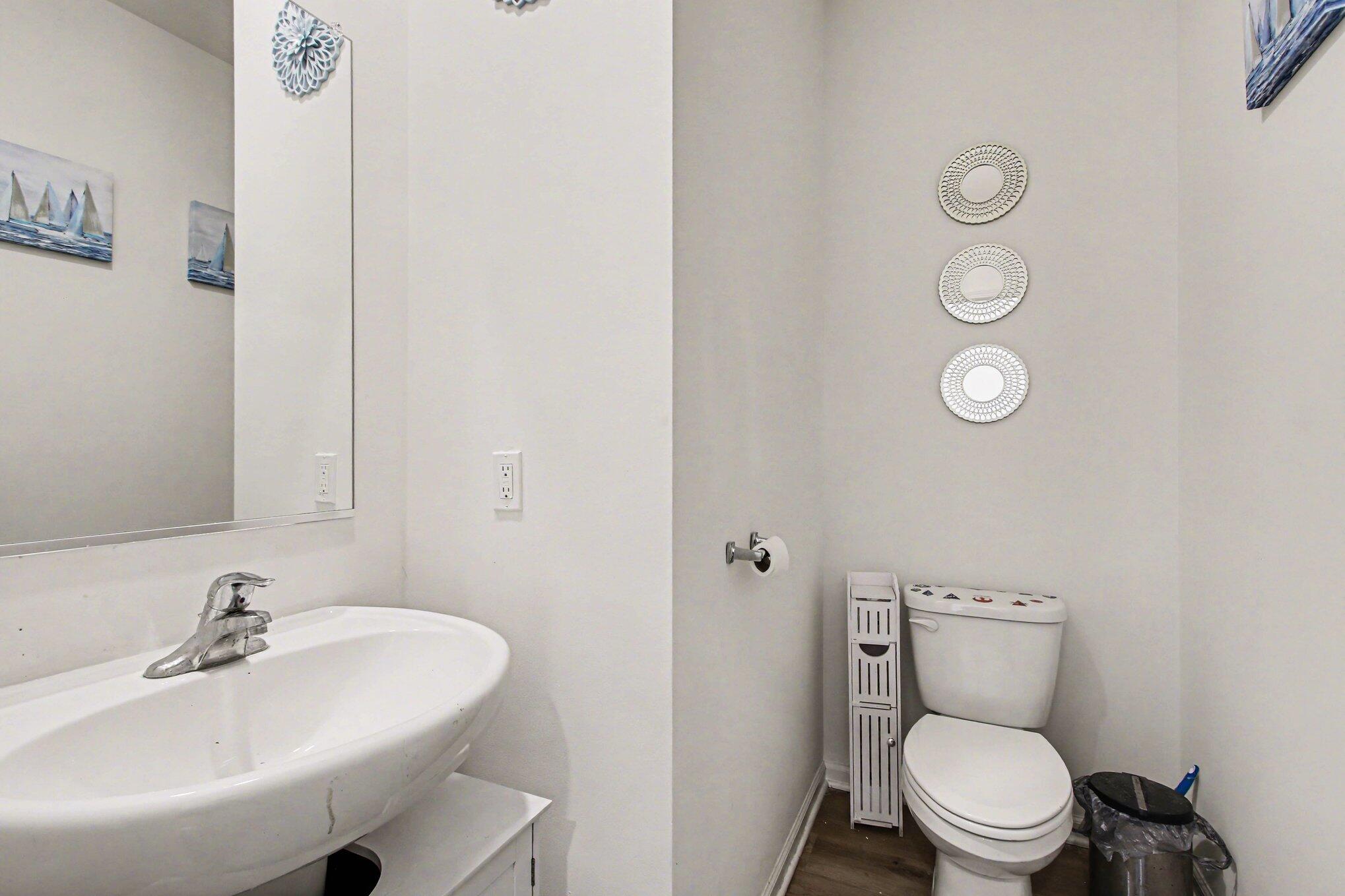 10560 Azalea Drive Crown Point, IN 46307 - Photo 12 of 26 a bathroom with a toilet sink and mirror