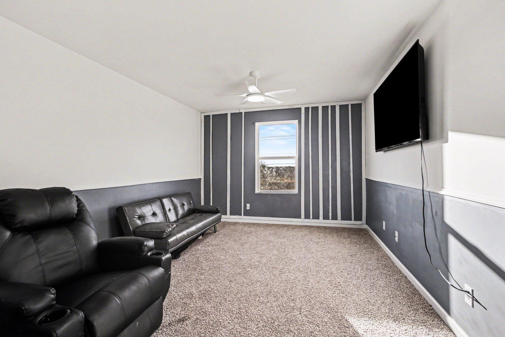 10560 Azalea Drive Crown Point, IN 46307 - Photo 13 of 26 a living room with furniture and a flat screen tv