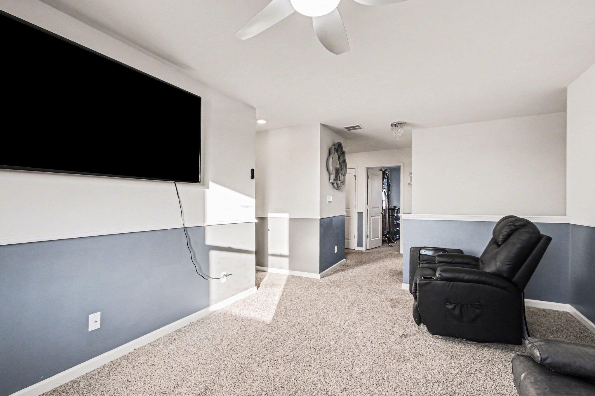 10560 Azalea Drive Crown Point, IN 46307 - Photo 14 of 26 a living room with furniture and a flat screen tv