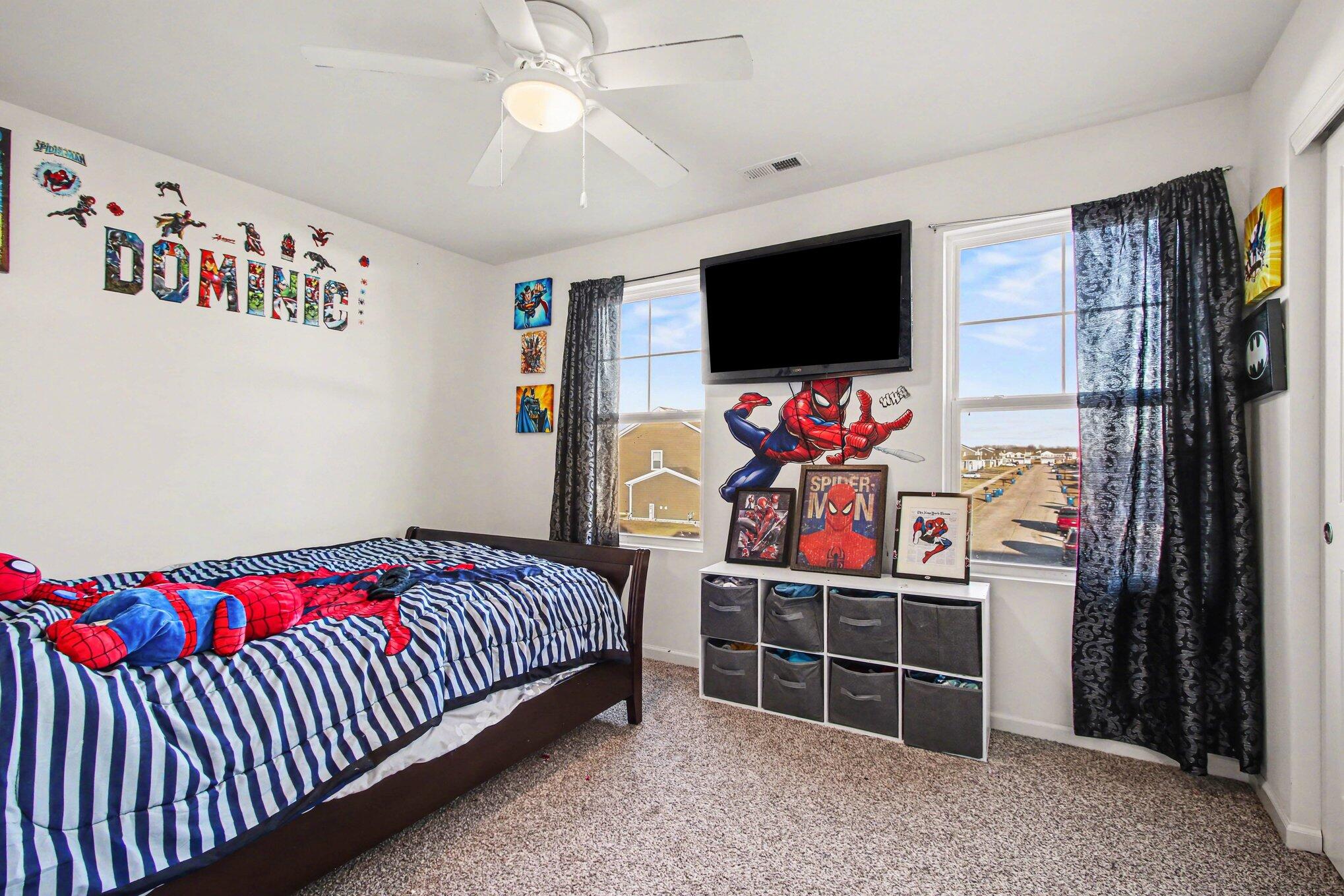 10560 Azalea Drive Crown Point, IN 46307 - Photo 19 of 26 a bedroom with furniture window and flat screen tv
