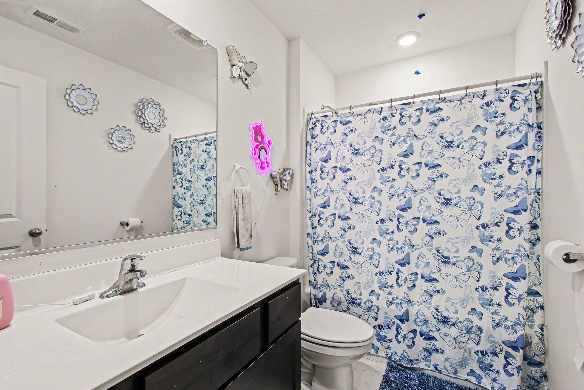 10560 Azalea Drive Crown Point, IN 46307 - Photo 21 of 26 a bathroom with a sink toilet and a mirror
