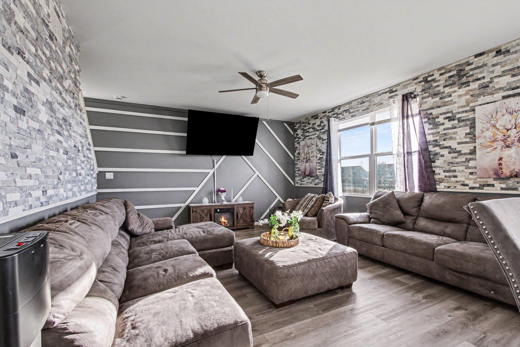 10560 Azalea Drive Crown Point, IN 46307 - Photo 5 of 26 a living room with furniture and a flat screen tv