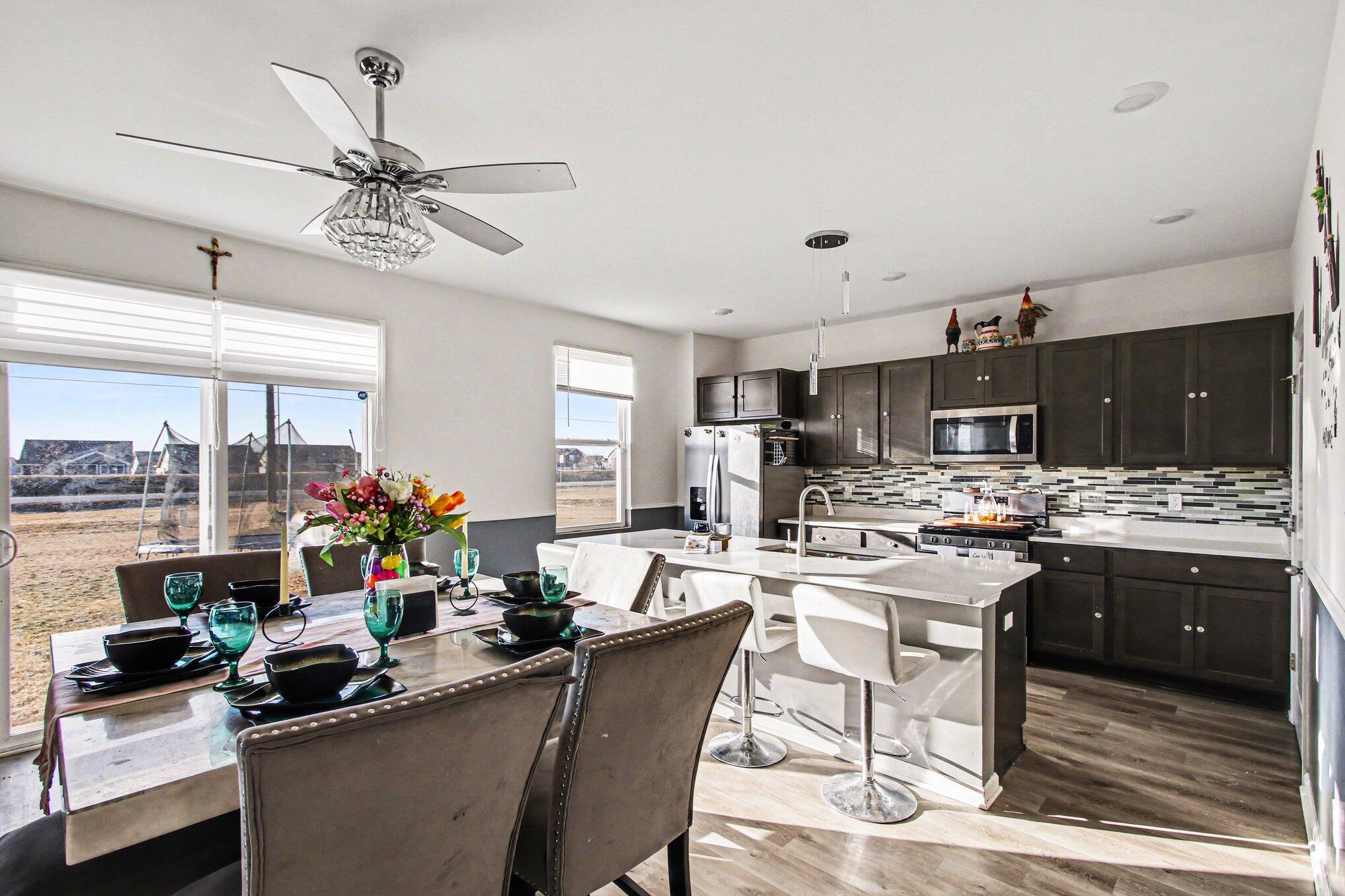 10560 Azalea Drive Crown Point, IN 46307 - Photo 7 of 26 a kitchen with a sink stove and cabinets