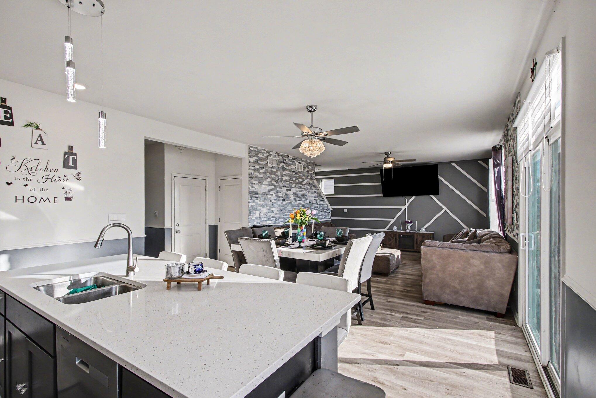 10560 Azalea Drive Crown Point, IN 46307 - Photo 10 of 26 a living room with furniture and a chandelier