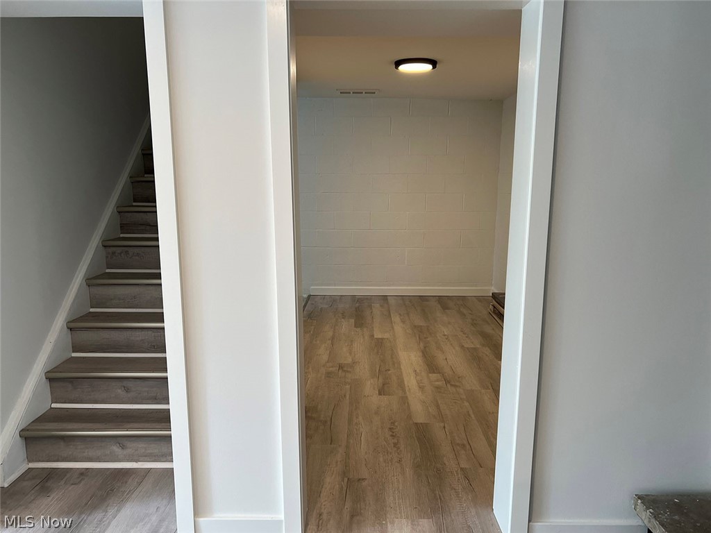 550 Johnson Road Wadsworth, OH 44281 - Photo 25 of 40 Hallway featuring hardwood / wood-style flooring