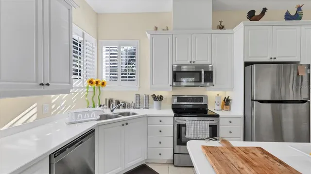 a view of a dining room with furniture wooden floor and chandelier