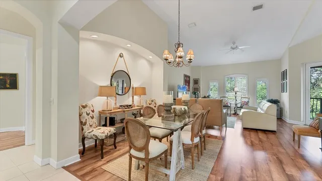 a bedroom with two beds and a large window