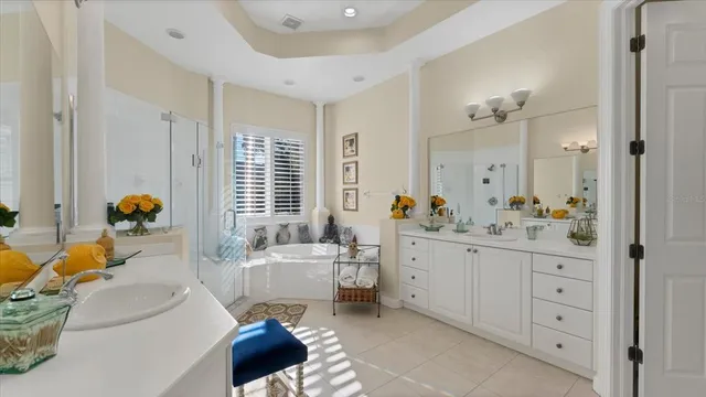 a bedroom with two beds and a painting on the wall