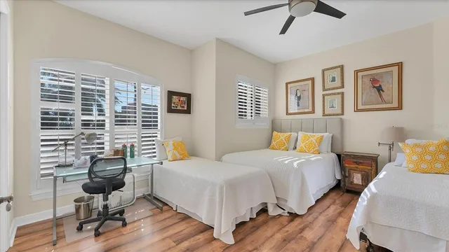 a bedroom with a bed and wall painting