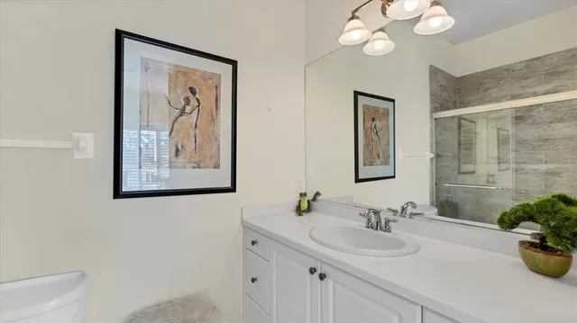 a front view of a house with plants