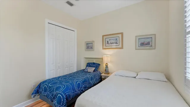 an aerial view of multiple houses with a yard