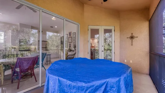 a view of a swimming pool with outdoor seating