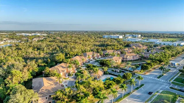 an aerial view of residential houses with outdoor space