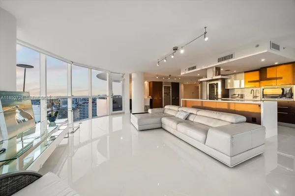 a living room with furniture and a large window