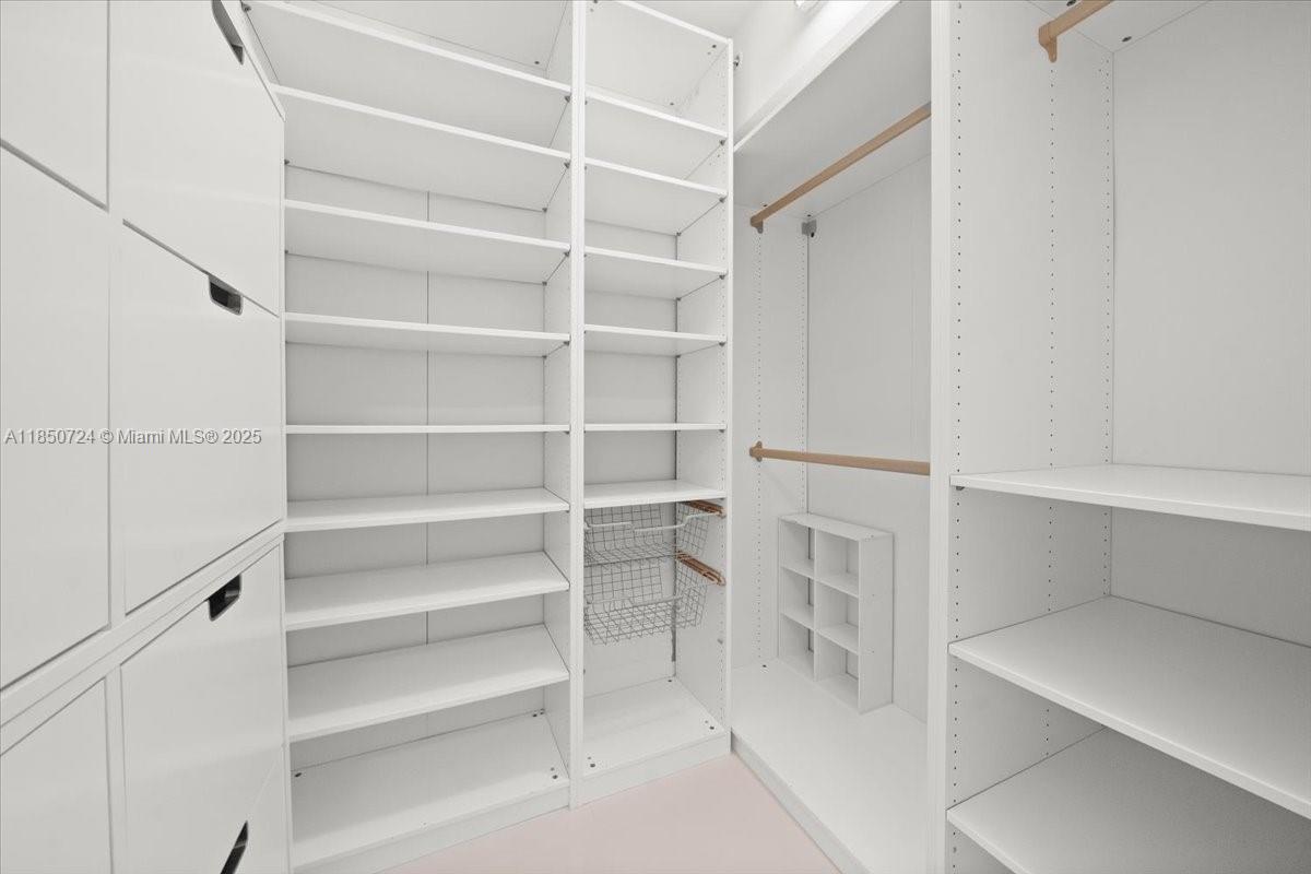 6301 Collins Avenue, Unit 2705 Miami Beach, FL 33141 - Photo 13 of 41 a view of walk in closet with empty racks