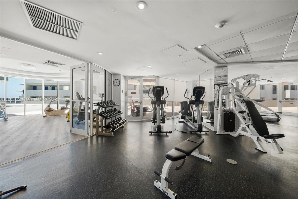 6301 Collins Avenue, Unit 2705 Miami Beach, FL 33141 - Photo 27 of 41 a view of a room with gym equipment