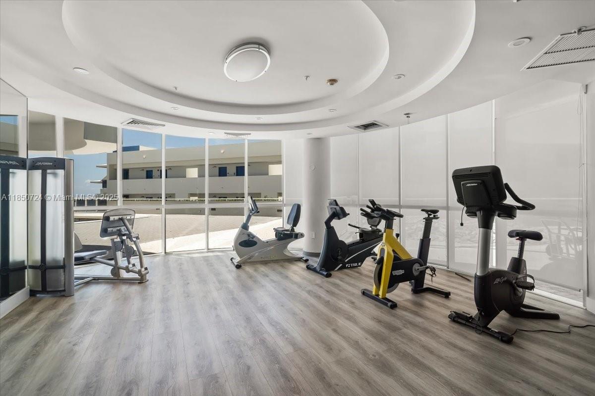 6301 Collins Avenue, Unit 2705 Miami Beach, FL 33141 - Photo 28 of 41 a view of a room with gym equipment