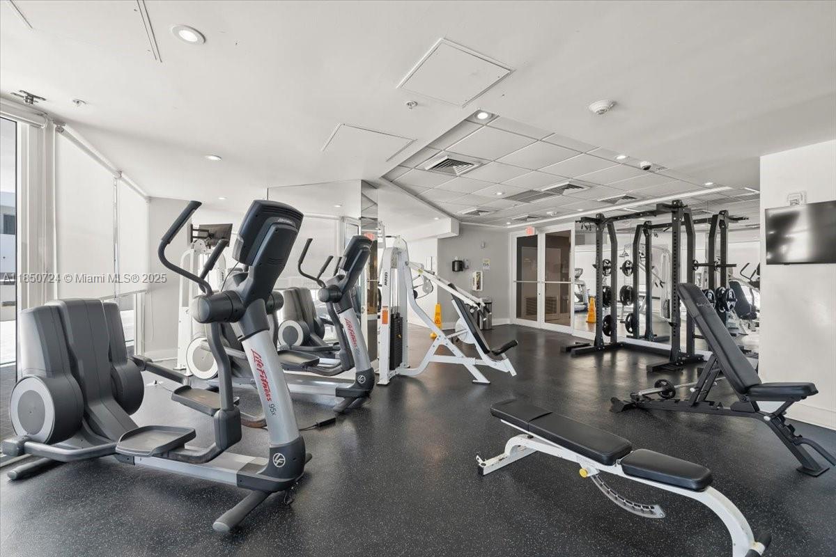 6301 Collins Avenue, Unit 2705 Miami Beach, FL 33141 - Photo 29 of 41 a view of a room with gym equipment