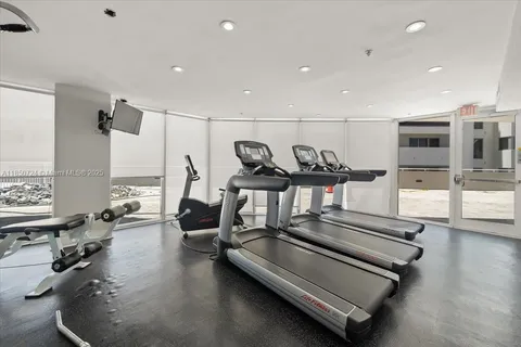 a gym area with gym equipment