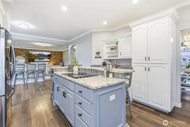 a view of a dining room with furniture wooden floor and a chandelier