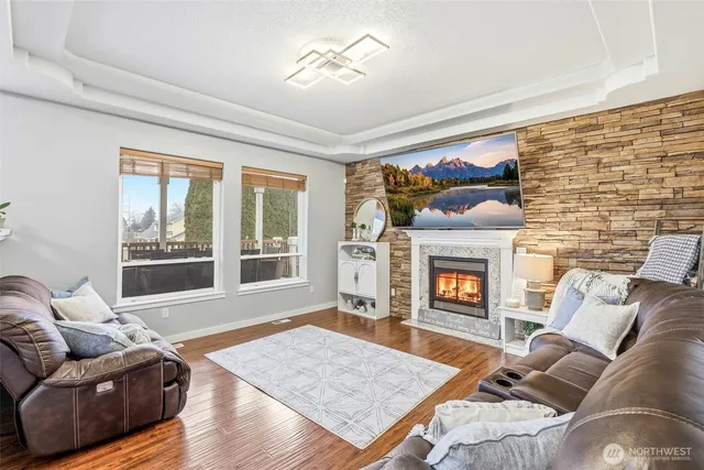 a spacious bedroom with a bed and a dresser