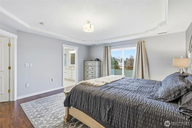 a bedroom with a bed and dresser