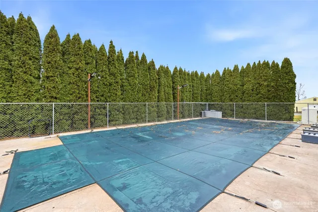 an aerial view of a house with swimming pool
