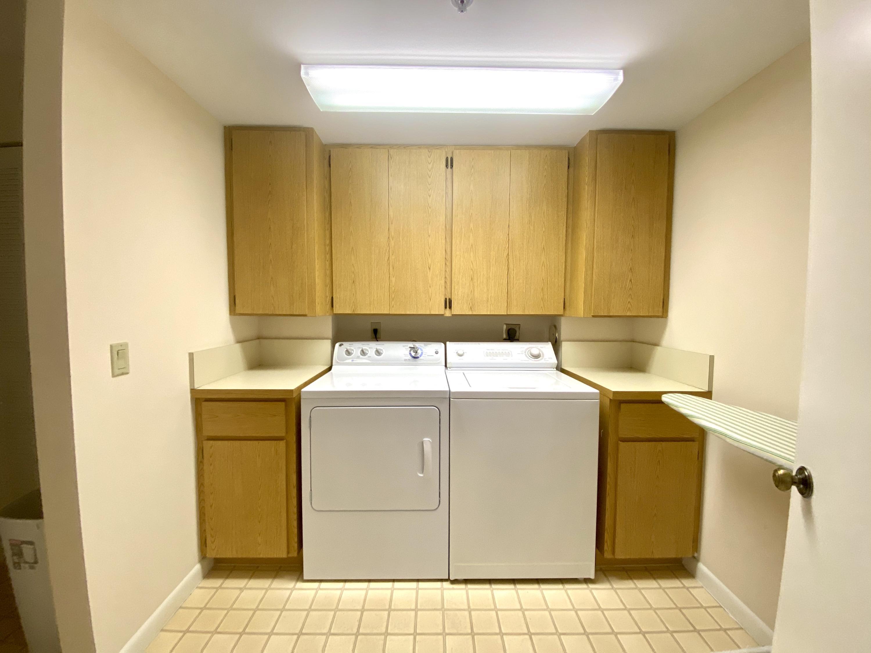 2301 Marina Isle Way, Unit 503 Jupiter, FL 33477 - Photo 39 of 45 a utility room with washer and dryer