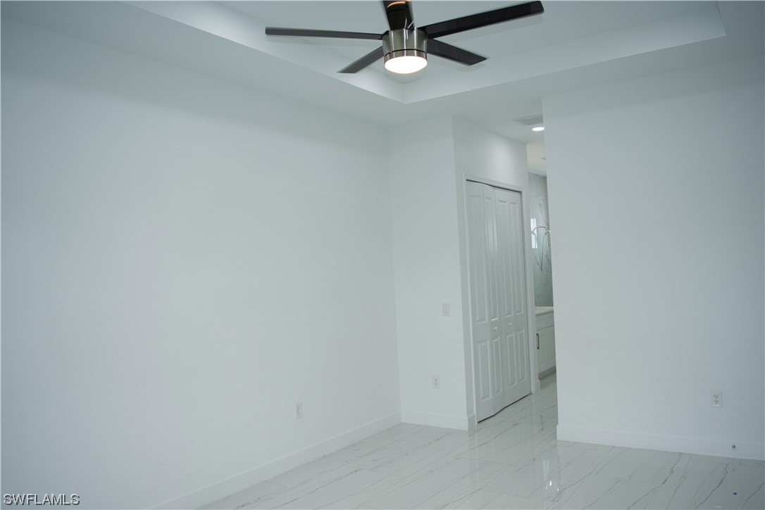 3718 41st Street Southwest Lehigh Acres, FL 33976 - Photo 19 of 28 wooden floor in an empty room