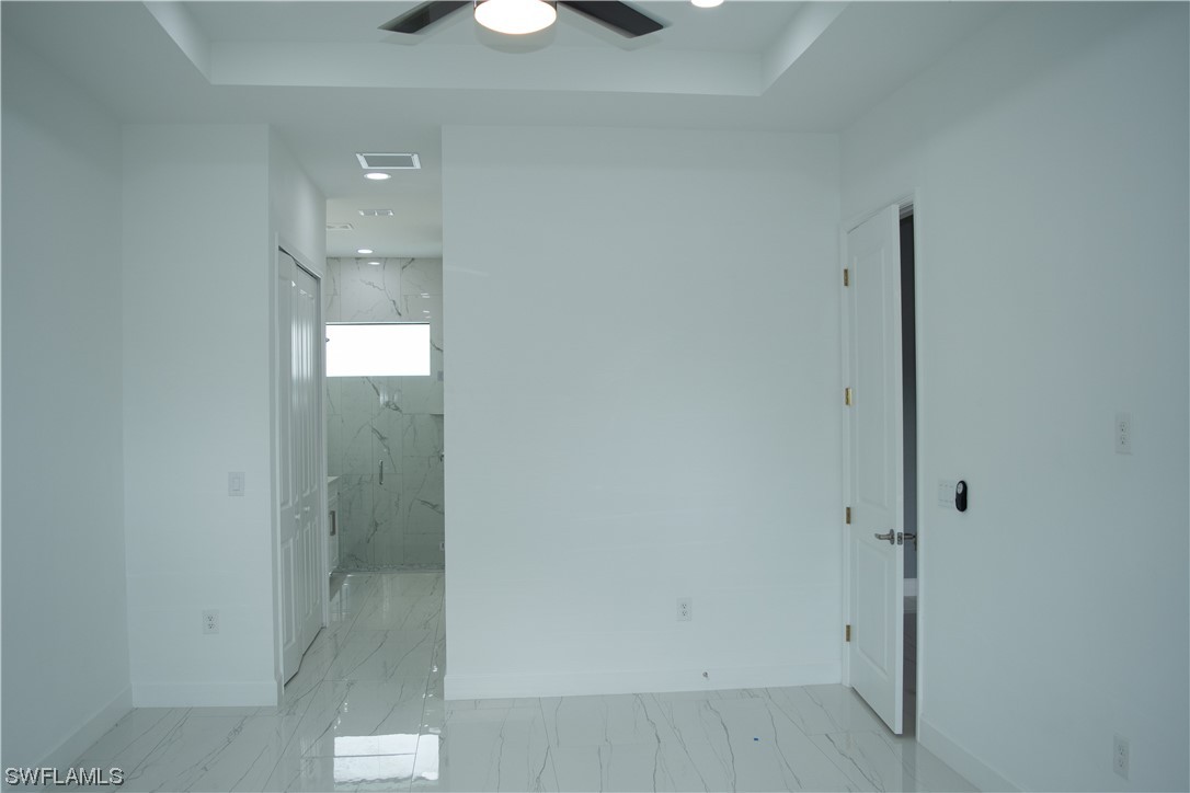 3718 41st Street Southwest Lehigh Acres, FL 33976 - Photo 22 of 28 an empty room with mirror and shower