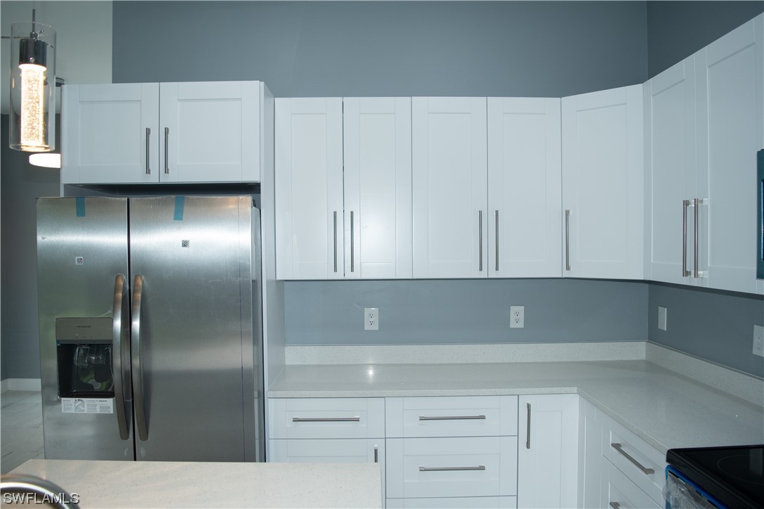 3718 41st Street Southwest Lehigh Acres, FL 33976 - Photo 27 of 28 a view of cabinets and window