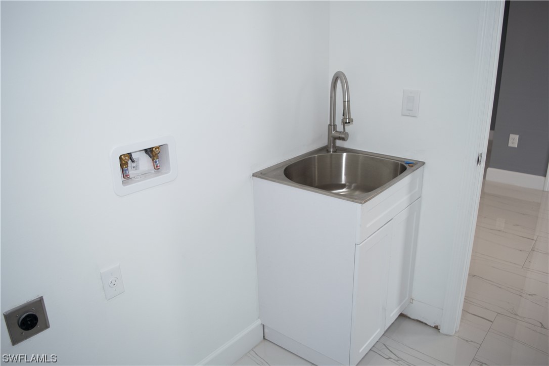 3718 41st Street Southwest Lehigh Acres, FL 33976 - Photo 28 of 28 a close view of a sink and tap