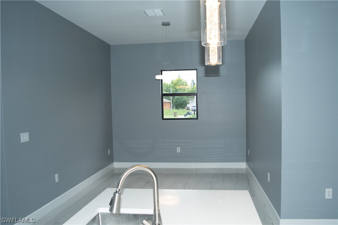 3718 41st Street Southwest Lehigh Acres, FL 33976 - Photo 7 of 28 a view of a window in a room