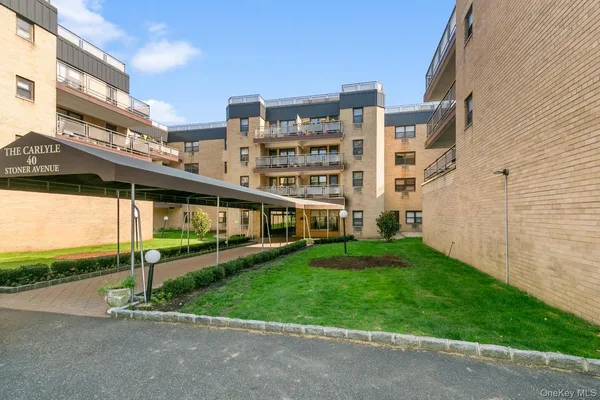 a view of a building with a yard