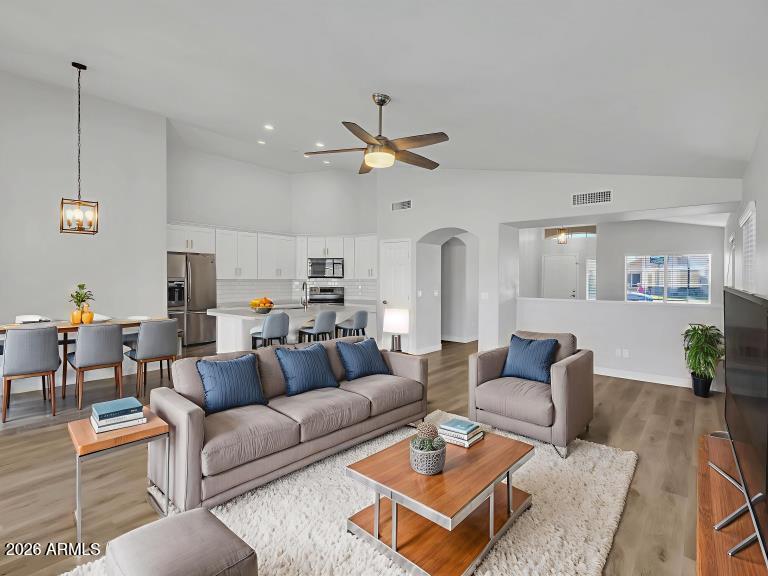 13402 East Boston Street Chandler, AZ 85225 - Photo 2 of 19 a living room with furniture ceiling fan and a rug