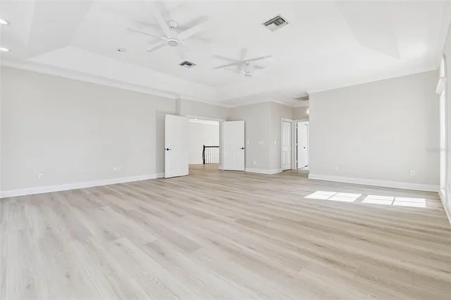 a bathroom with a granite countertop toilet sink and mirror