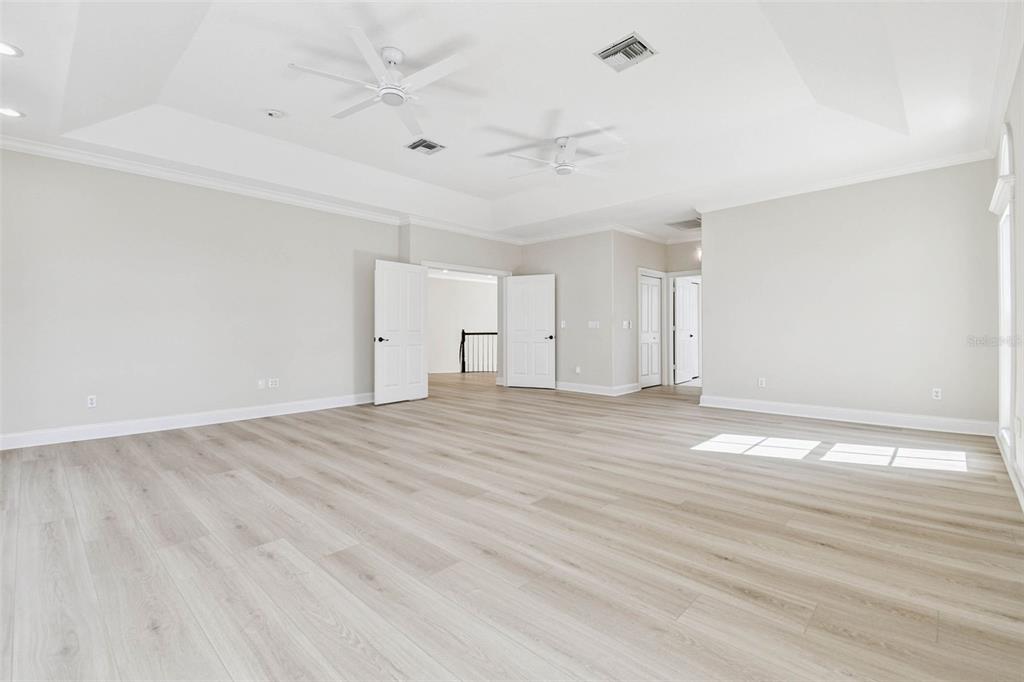 3505 Berger Road Lutz, FL 33548 - Photo 33 of 79 a view of empty room with wooden floor and fan