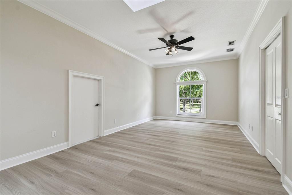 3505 Berger Road Lutz, FL 33548 - Photo 47 of 79 wooden floor in an empty room with a window