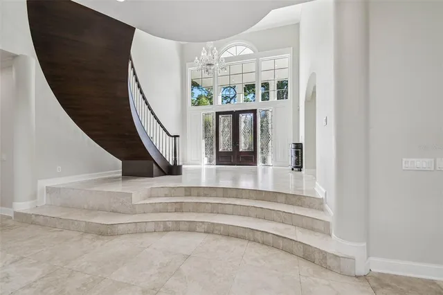 a view of a dining room with furniture wooden floor and windows