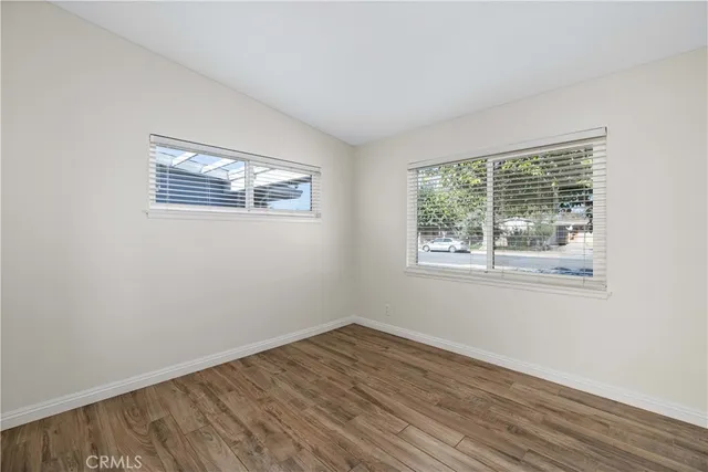 a view of a kitchen cabinets and wooden floor