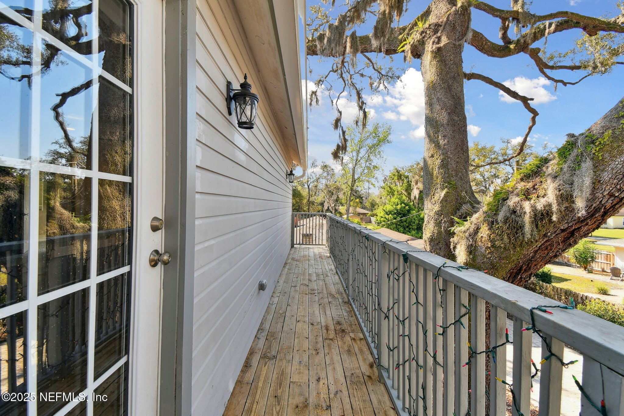 12277 Mandarin Road Jacksonville, FL 32223 - Photo 13 of 74 a view of a balcony with wooden floor