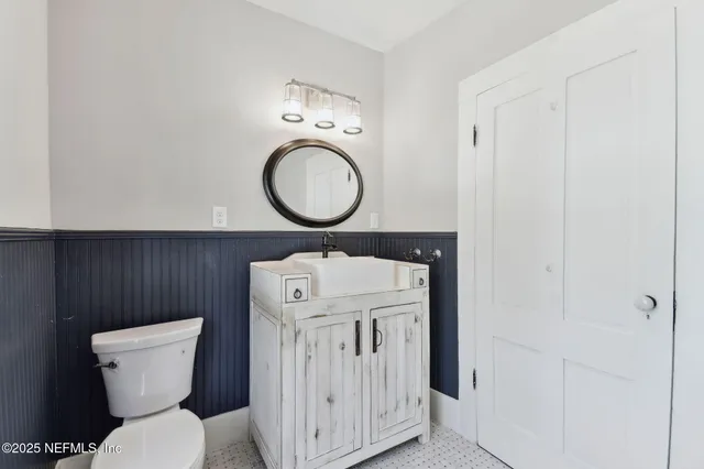 a kitchen with stainless steel appliances a refrigerator sink and cabinets