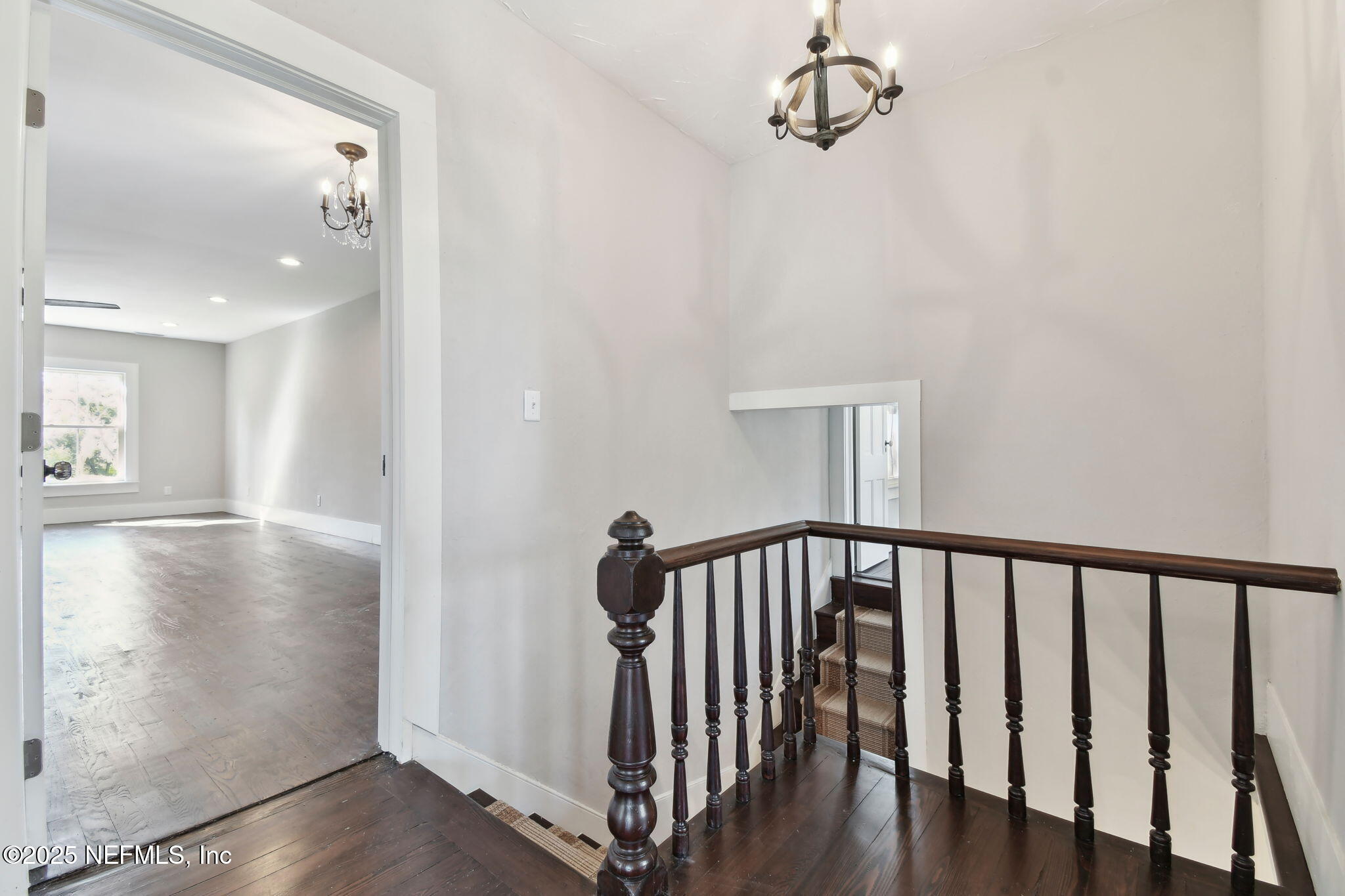 12277 Mandarin Road Jacksonville, FL 32223 - Photo 20 of 74 a view of a hallway with wooden floor and staircase