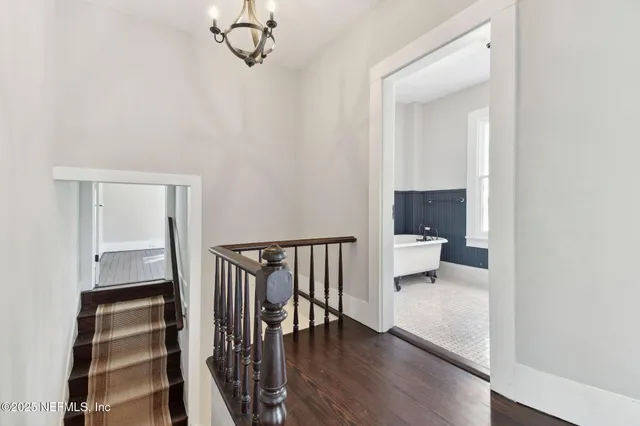 a view of backyard of house with green space