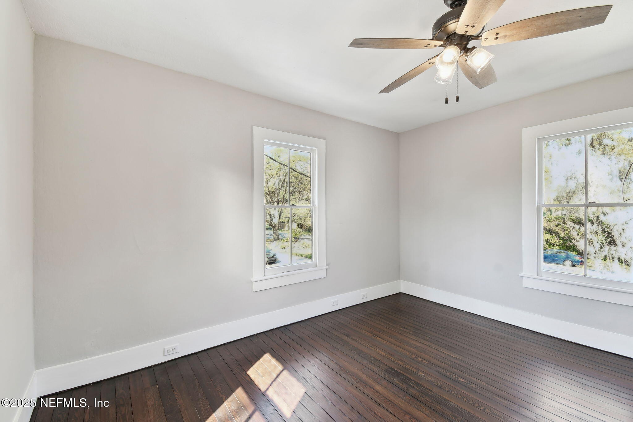 12277 Mandarin Road Jacksonville, FL 32223 - Photo 22 of 74 wooden floor in an empty room with a window