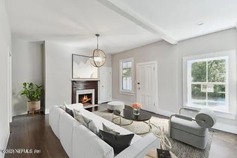 a kitchen with white cabinets and sink