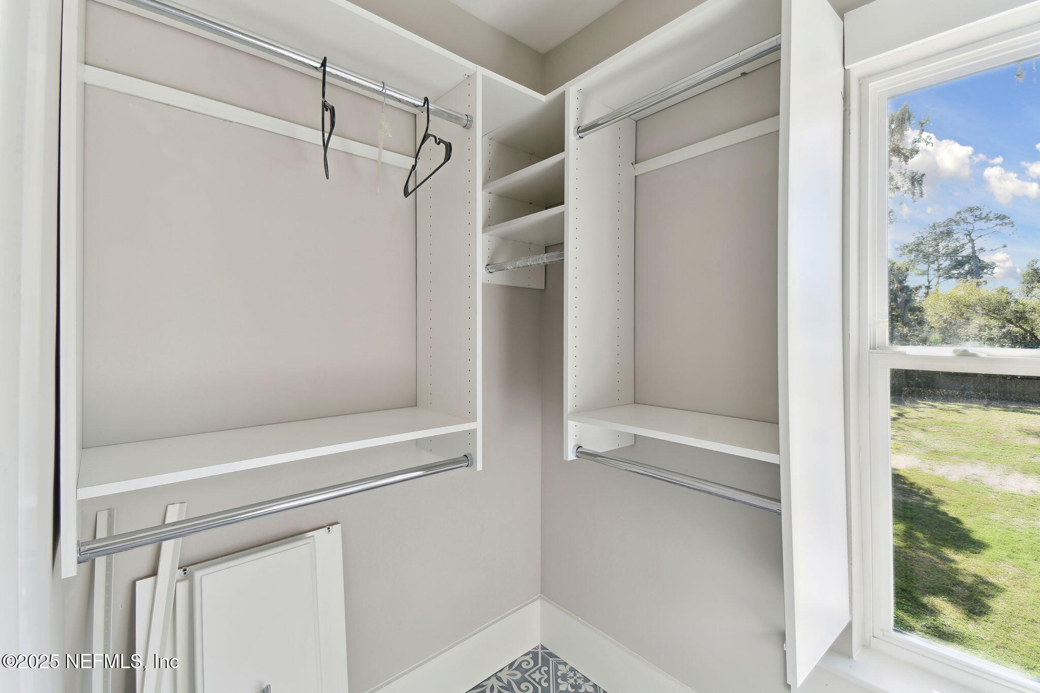 12277 Mandarin Road Jacksonville, FL 32223 - Photo 74 of 74 a bathroom with a glass shower door