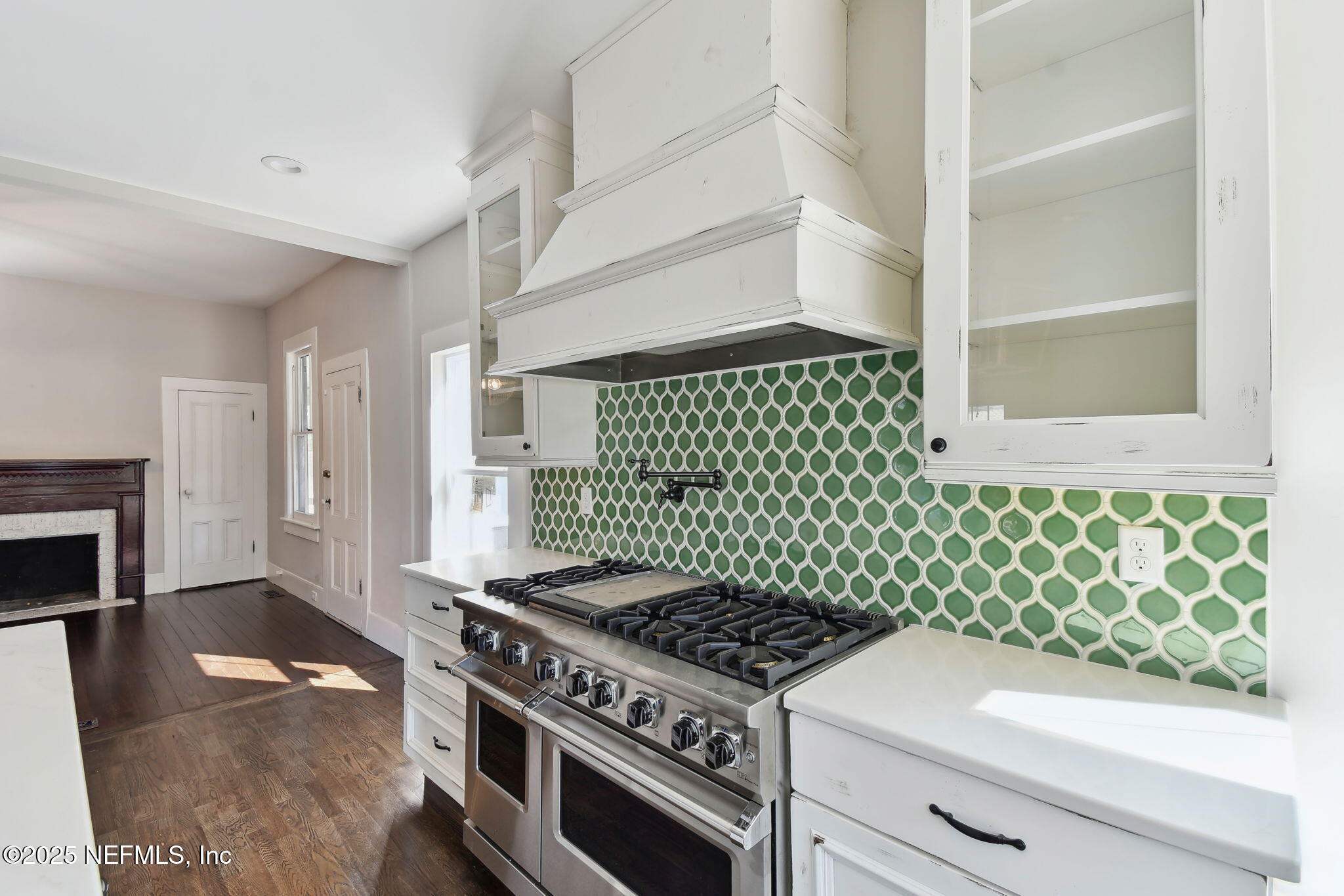 12277 Mandarin Road Jacksonville, FL 32223 - Photo 10 of 74 a kitchen with a stove and a microwave