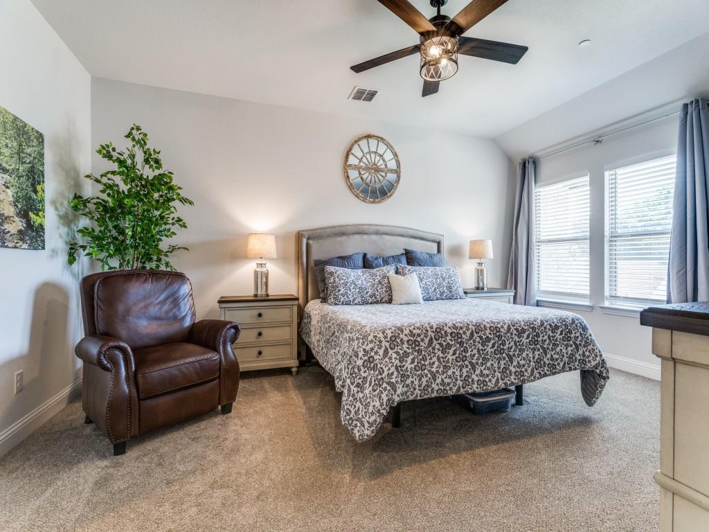 5944 Bursey Road Watauga, TX 76148 - Photo 14 of 25 a bedroom with a bed and a chair